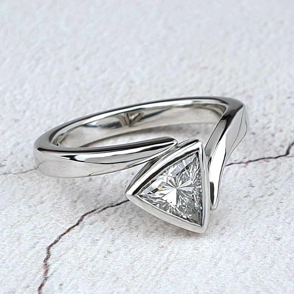 Flick ring with a Trilliant diamond Trilliant diamond engagement ring