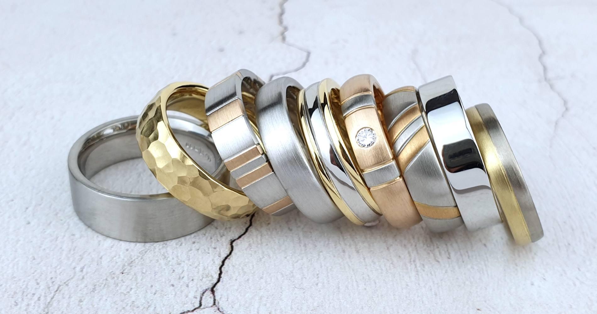 A row of unique wedding rings in platinum and gold