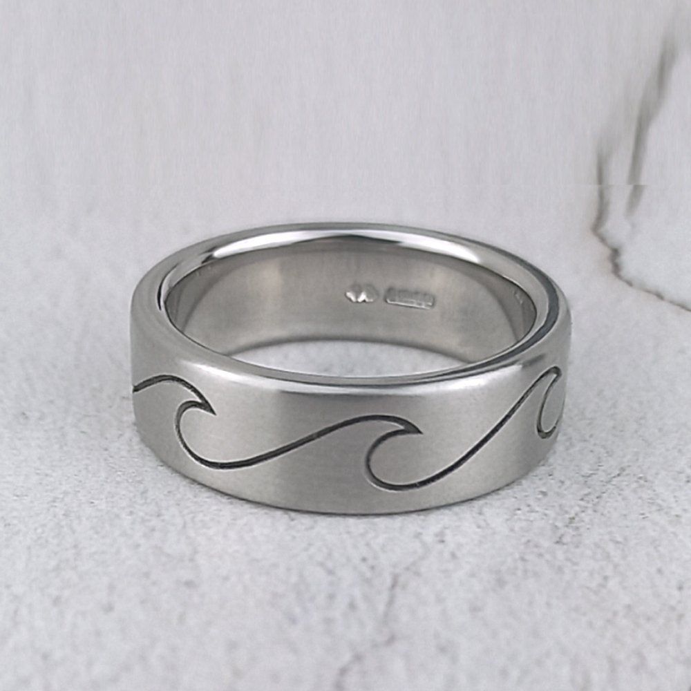 matte platinum ring with laser engraved wave design