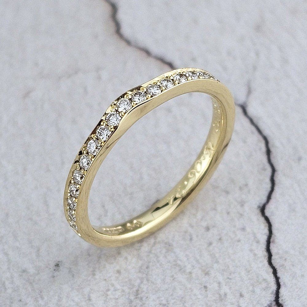 yellow gold wedding ring set with small diamonds