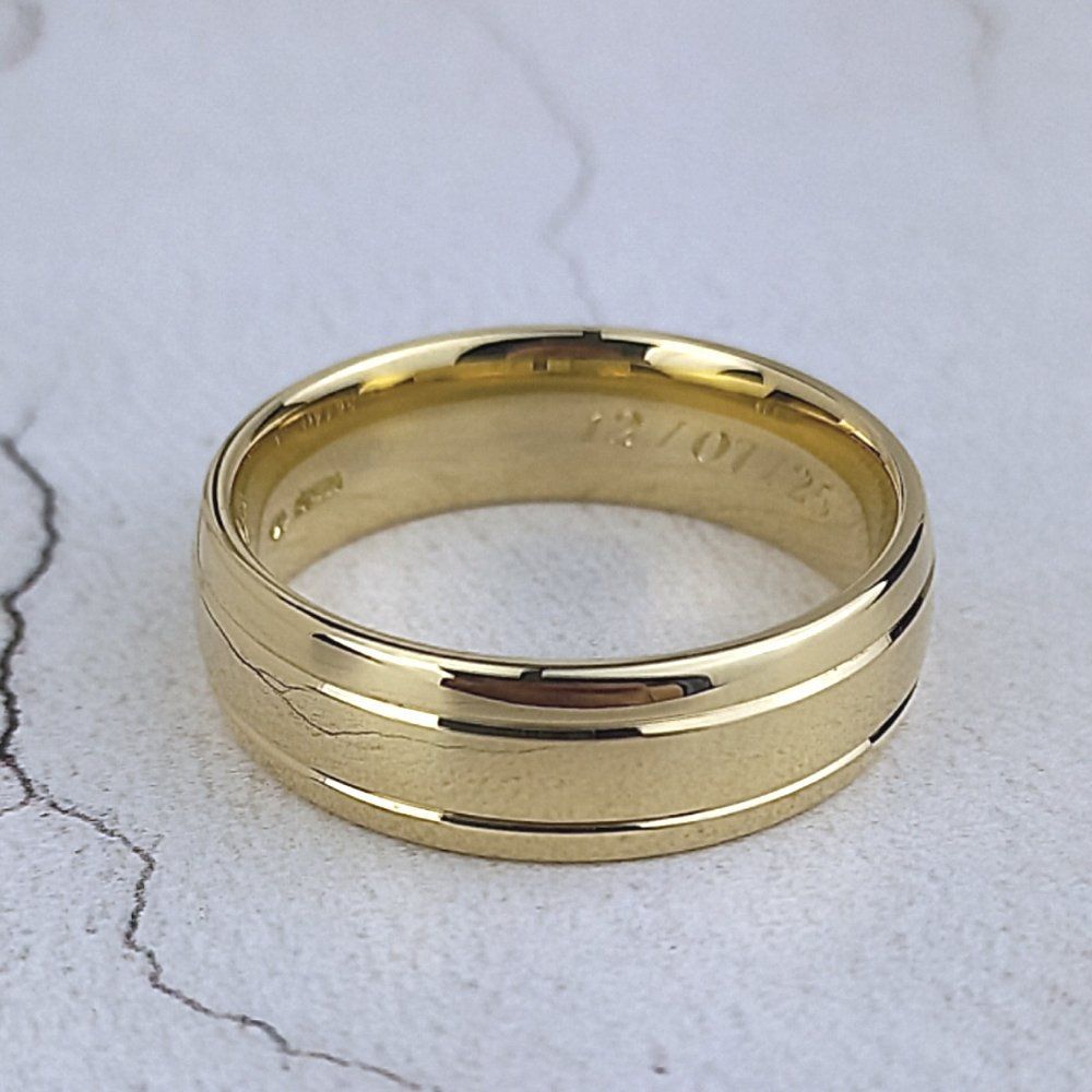 A wide court ring with two grooves