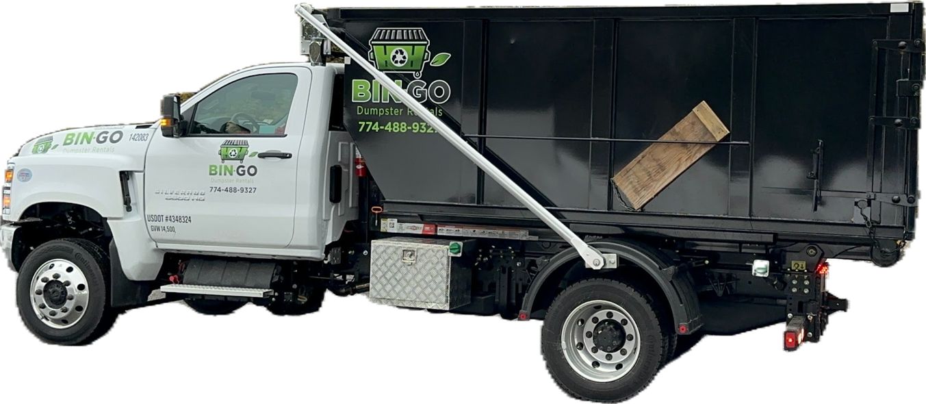 A white dump truck with a large black debris container on its flatbed, shown against a plain white background.