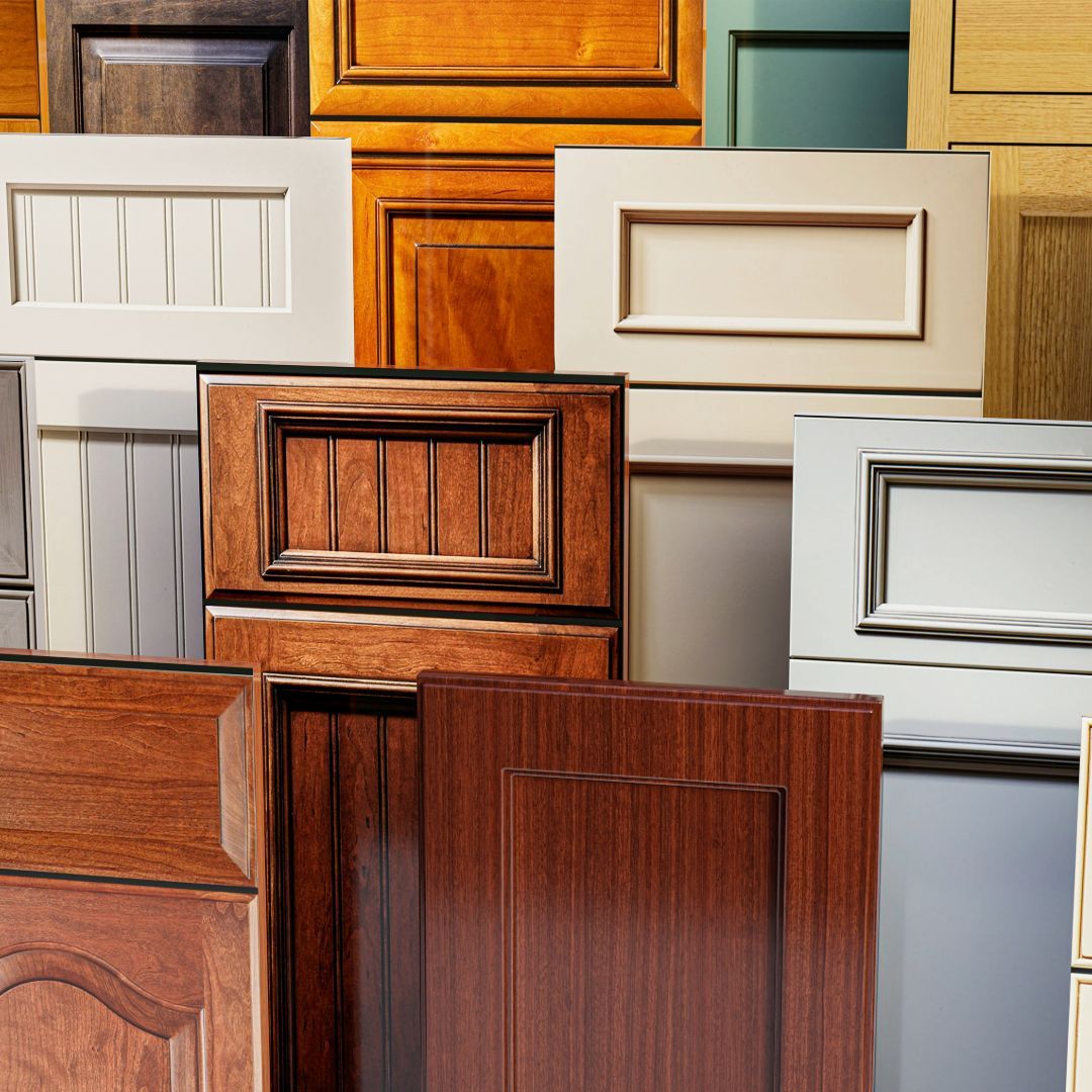 Collection of wooden cabinet door samples in various styles and colors.