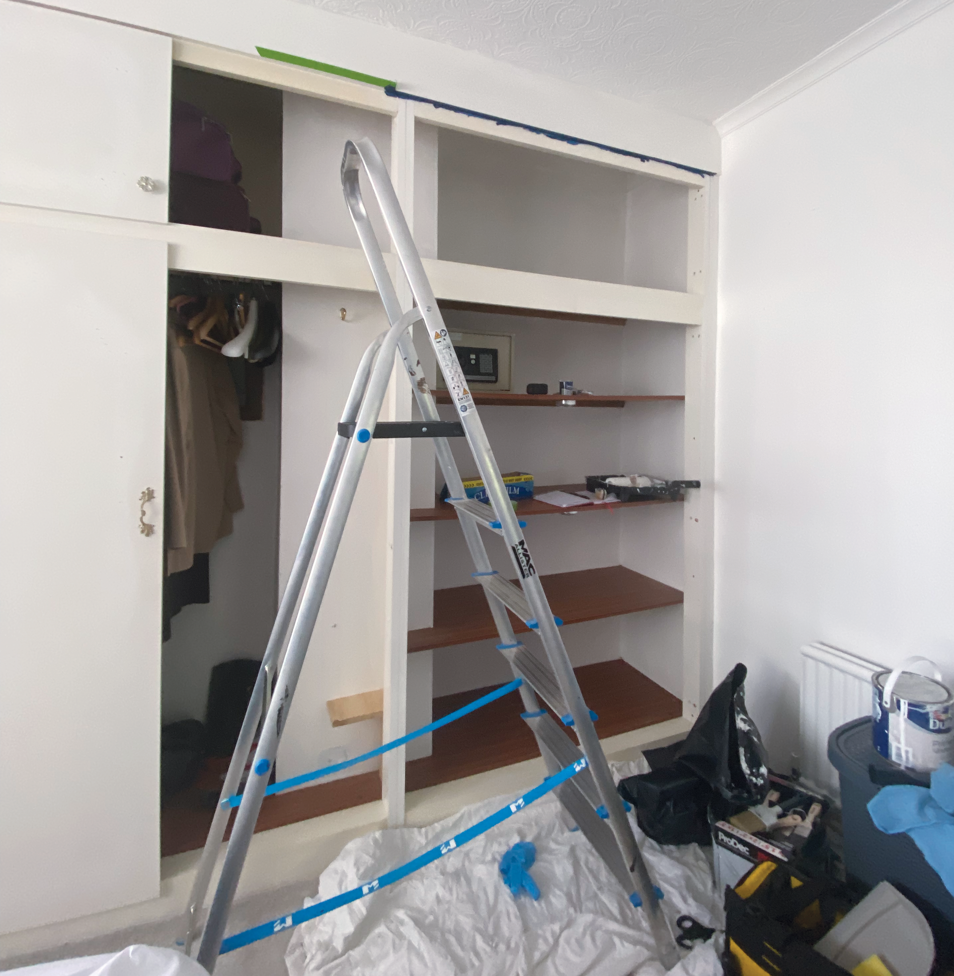 Making good the framework after removing existing doors and hinges;