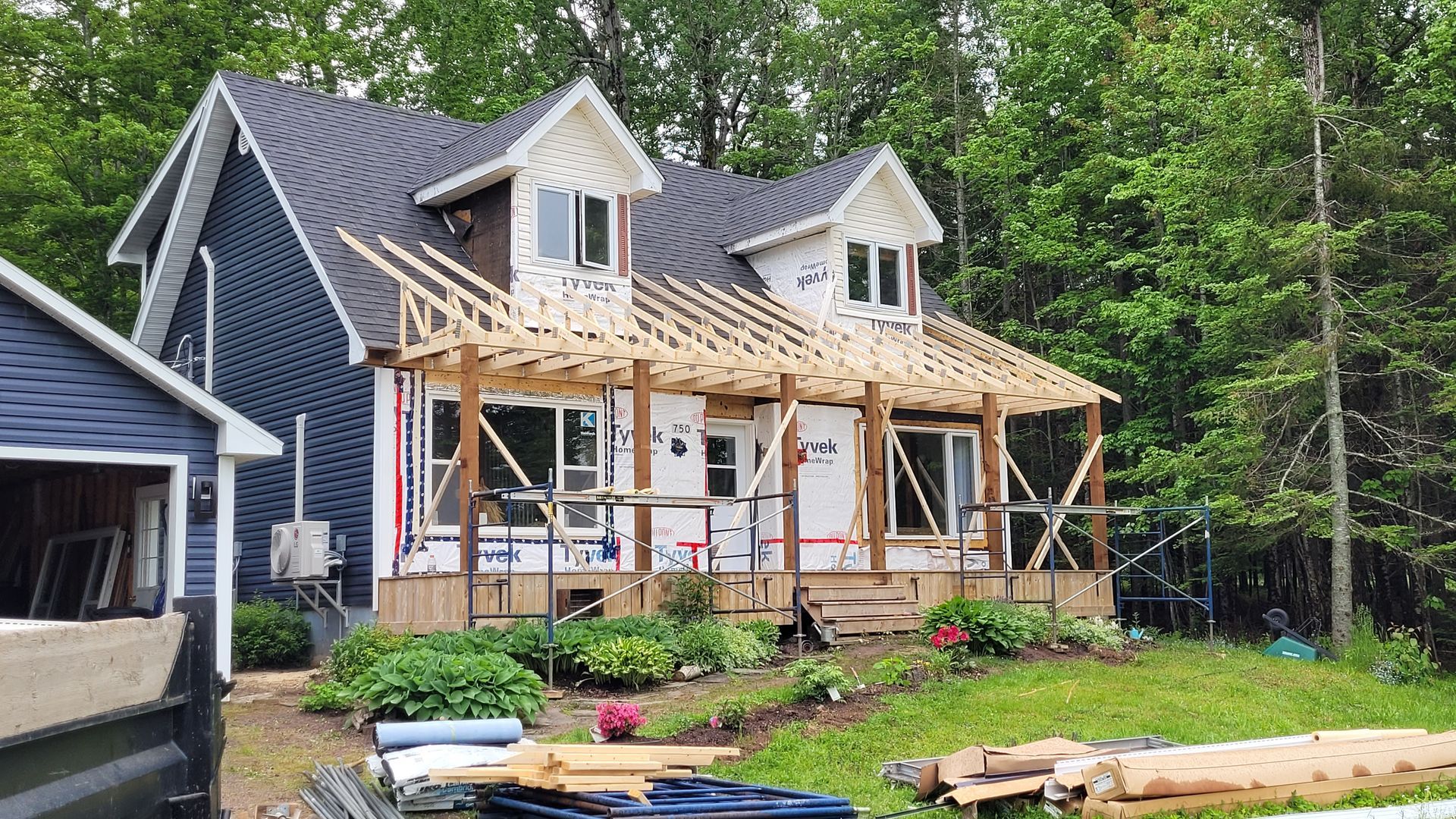 A house is being built in the middle of a forest.