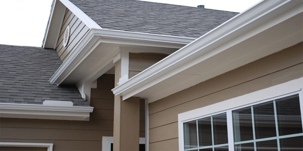A house with a roof and gutters and a window.