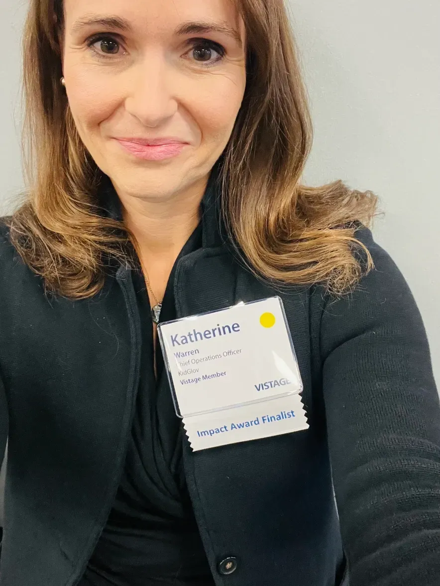 A woman wearing a name tag that says katherine