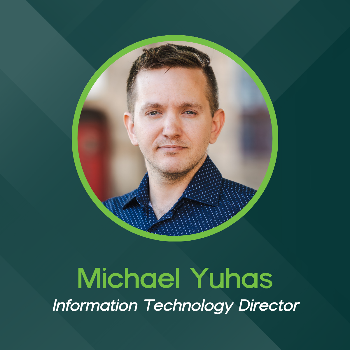 A circular headshot of Michael Yuhas, Information Technology Director, set against a dark green geometric background.