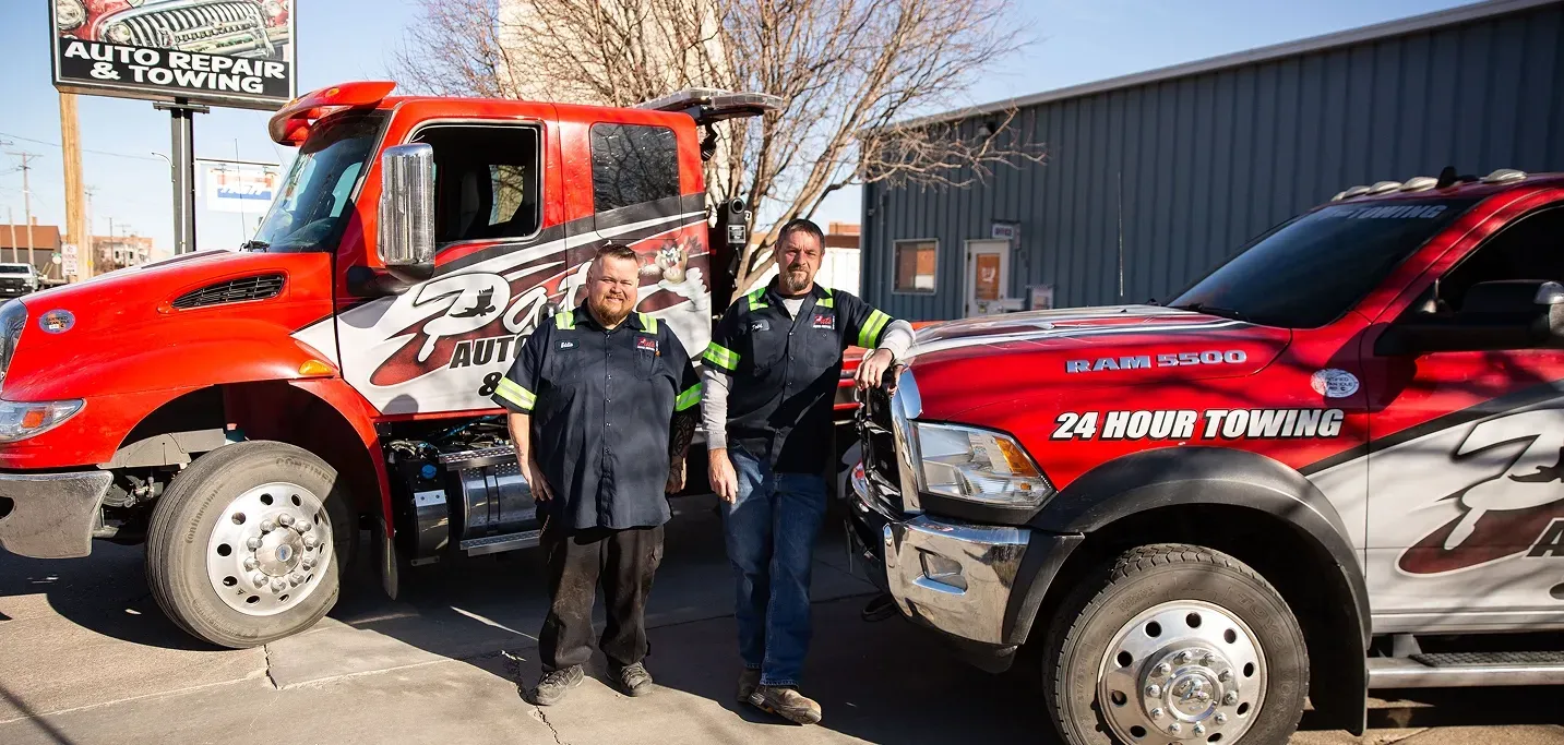 Our team standing by towing trucks reading for service in Hastings, NE | Pat's Auto Repair & Towing