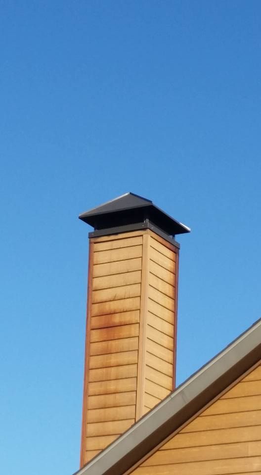 Wooden Chimney With Black Cap