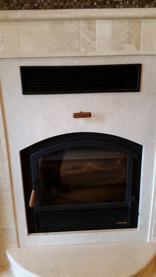 A Black And White Fireplace.