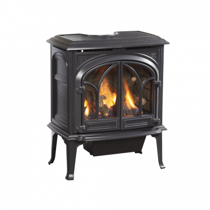 Black freestanding wood stove with lit fire behind glass doors