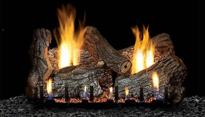 Two burning log piles in a black fireplace, with bright yellow-orange flames