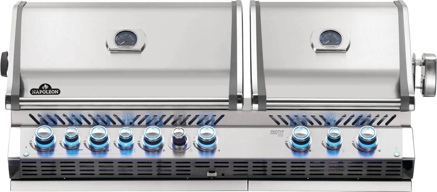 Two stainless steel gas grills with blue control knobs and closed lids