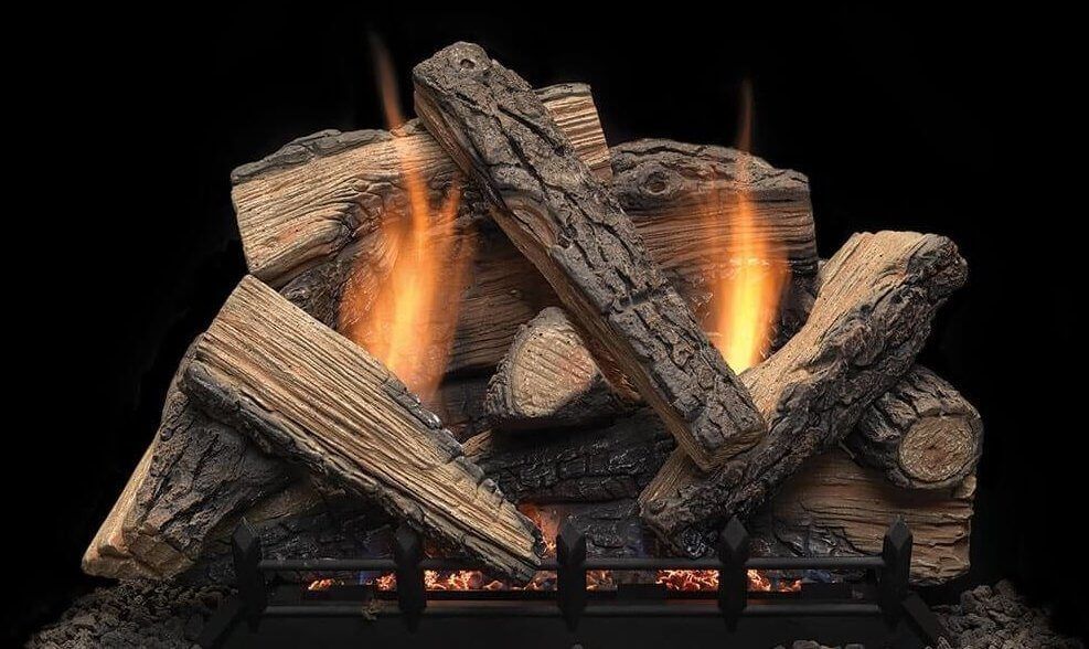Glowing gas log fireplace with faux wood and orange flames in a black surround