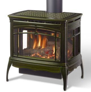 Green cast-iron wood stove with a fire burning inside
