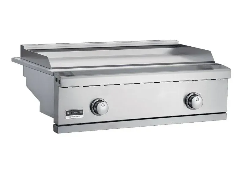 Stainless steel tabletop griddle with two control knobs and a flat cooking surface
