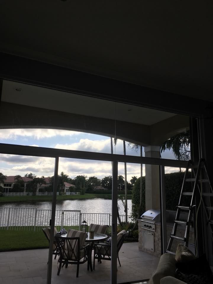 A view of a lake through a sliding glass door
