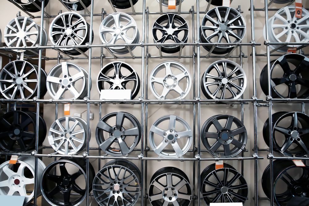 A Wall Filled With a Variety of Wheels and Tyres — Marx Forster Tyres & Mechanical In Forster, NSW