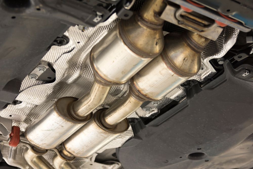 A Close Up of a Catalytic Converter on the Underside of a Car — Marx Forster Tyres & Mechanical In Forster, NSW