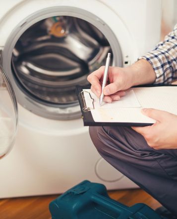 Checking The Washing Machine — Albion Park, NSW — Prime Appliance Service Checking The Washing Machine — Albion Park, NSW — Prime Appliance Service