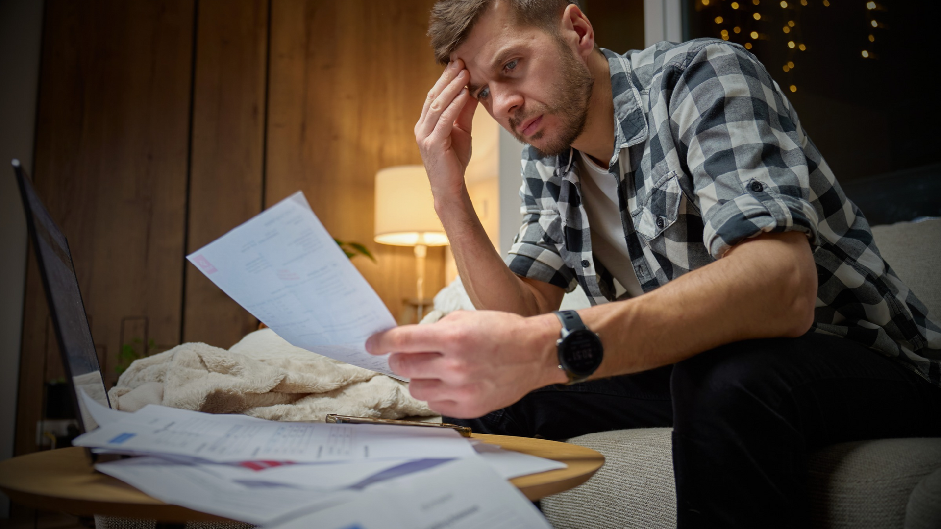 A man's mental health is stressed because of his finances.