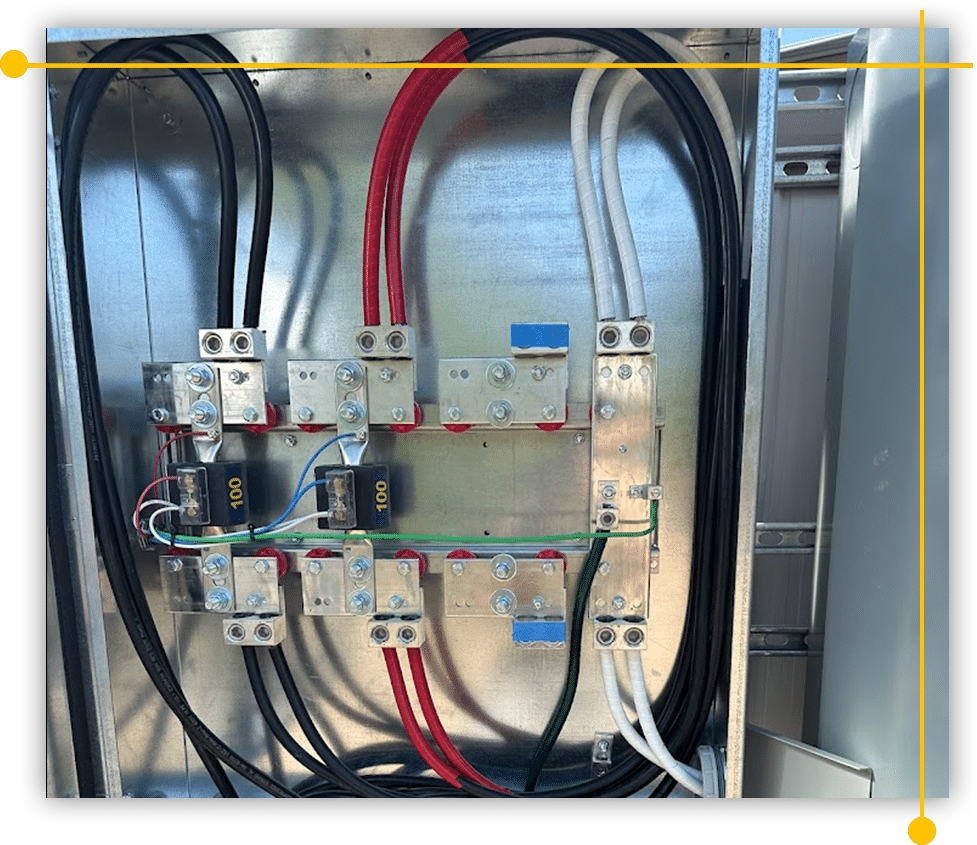 A metal box filled with electrical wires and connectors A metal box filled with electrical wires and connectors