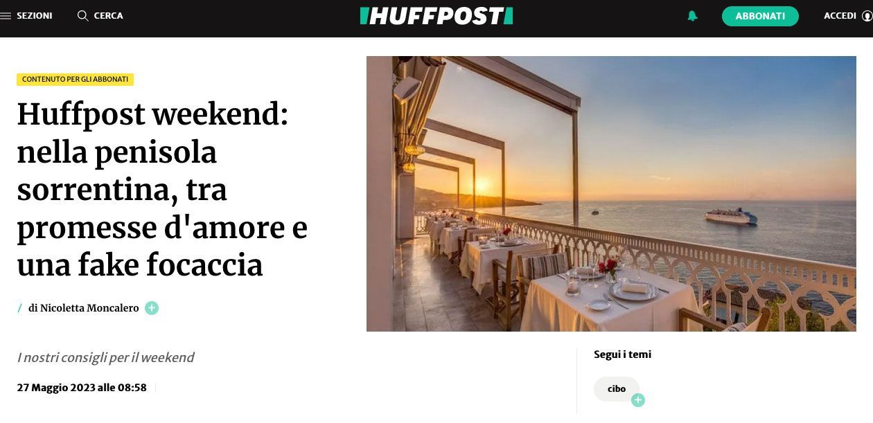 A HuffPost article header about the Sorrento Peninsula, featuring a seaside restaurant terrace at sunset.