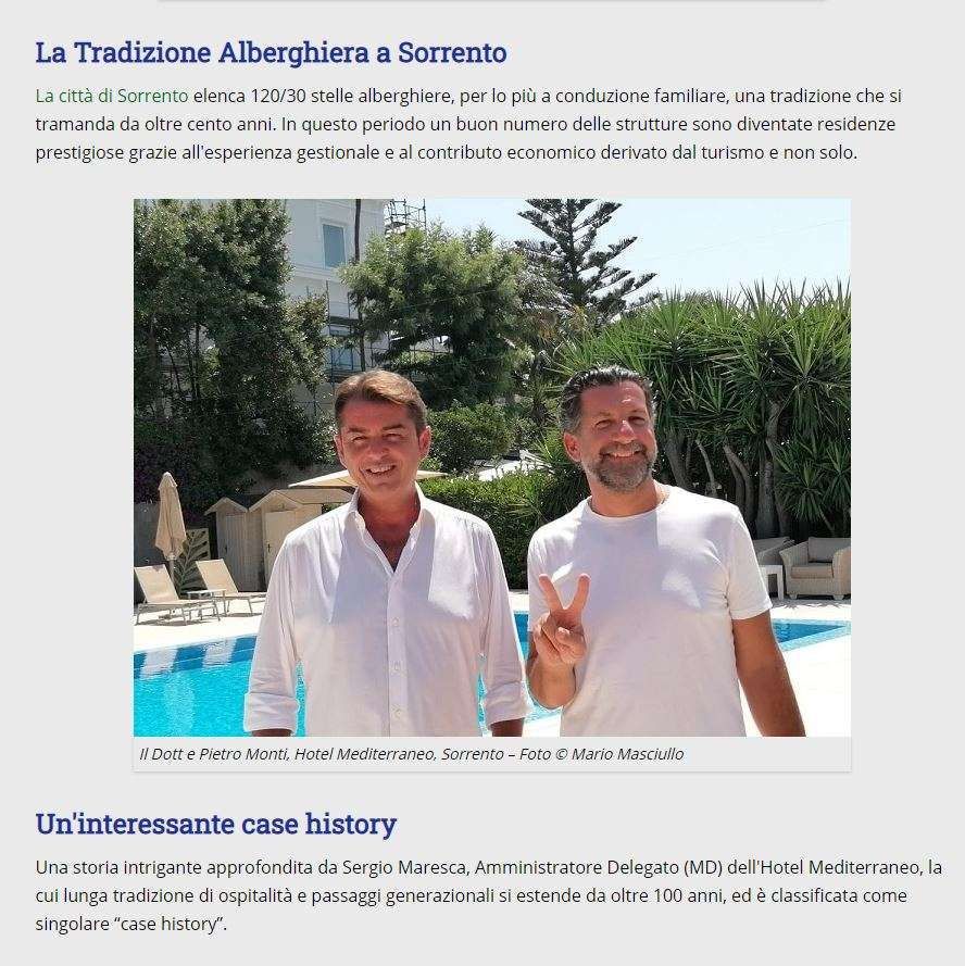 Two men smiling near a pool at Hotel Mediterraneo in Sorrento, as featured in an article about local hospitality history.