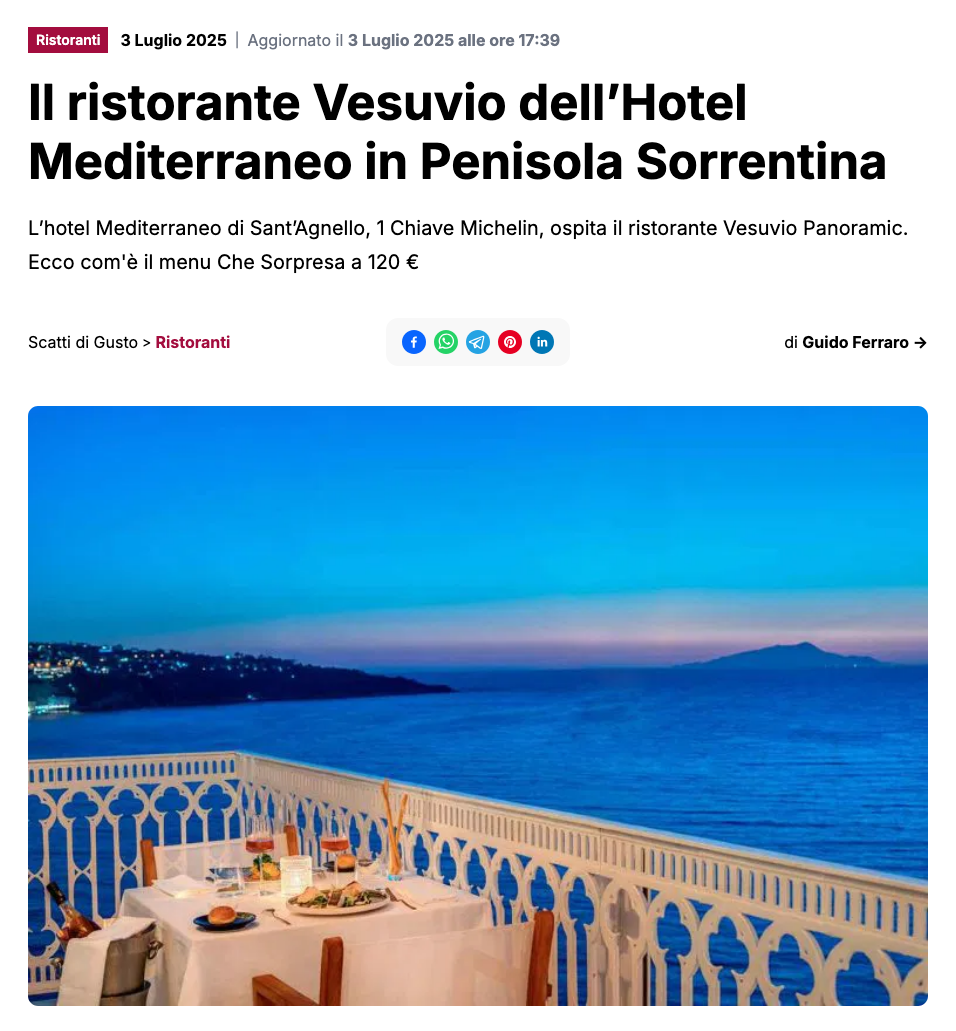 A table set for dinner on a balcony overlooking the sea at twilight, with the coastline visible in the distance.