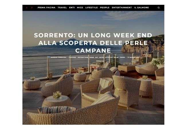 A terrace with wicker furniture overlooking the sea in Sorrento, with text overlaying the image.