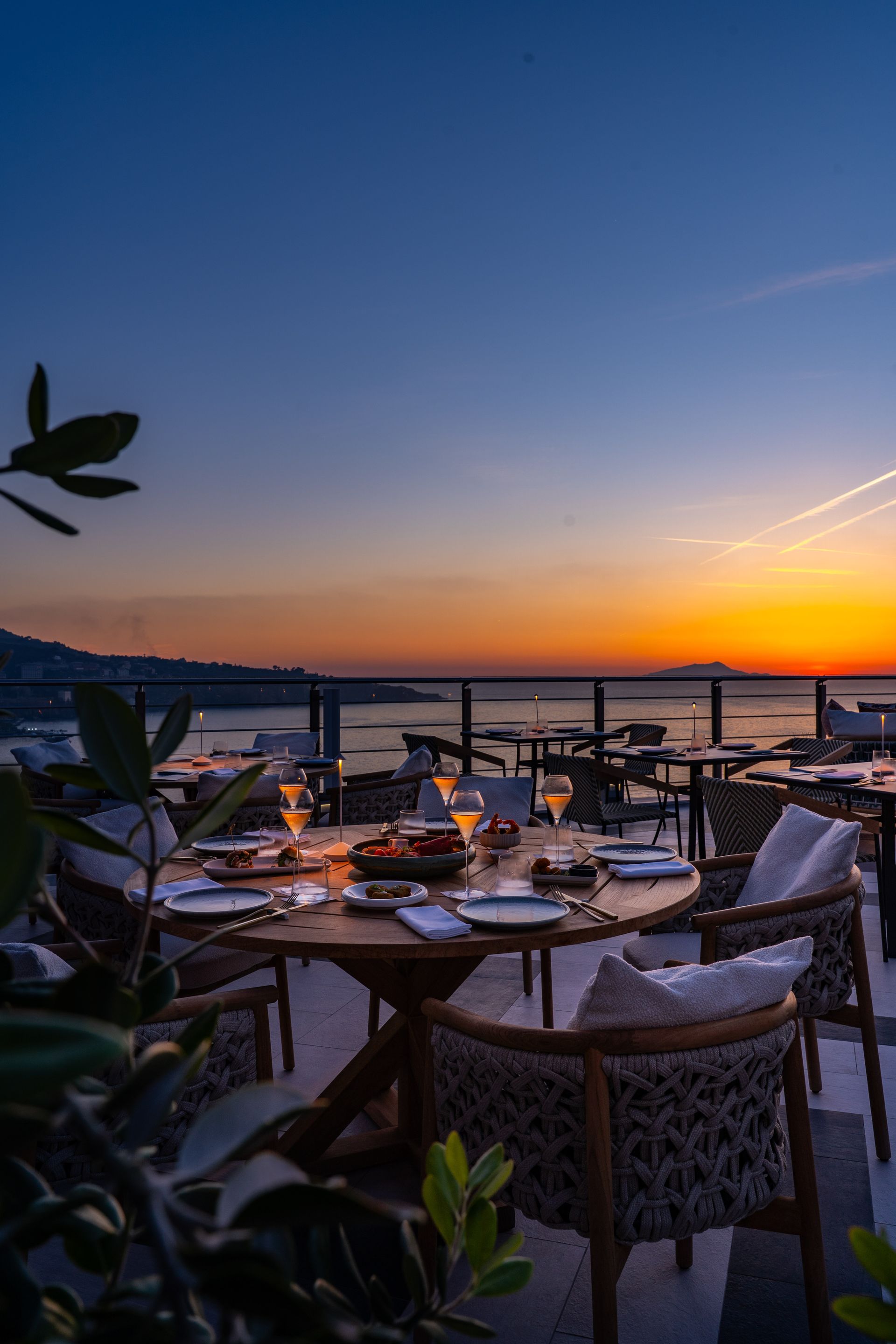 Sunset dining terrace at Vista Skybar & Dining by the sea.