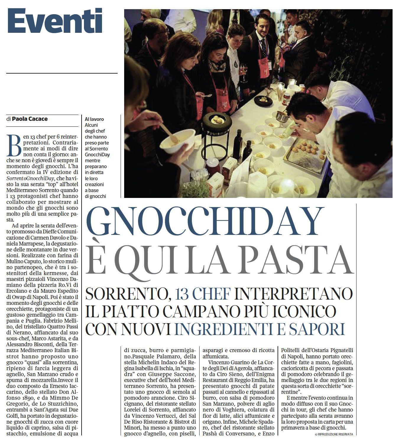A group of chefs stands around a table sampling and preparing food at a professional event in Sorrento for Gnocchi Day.