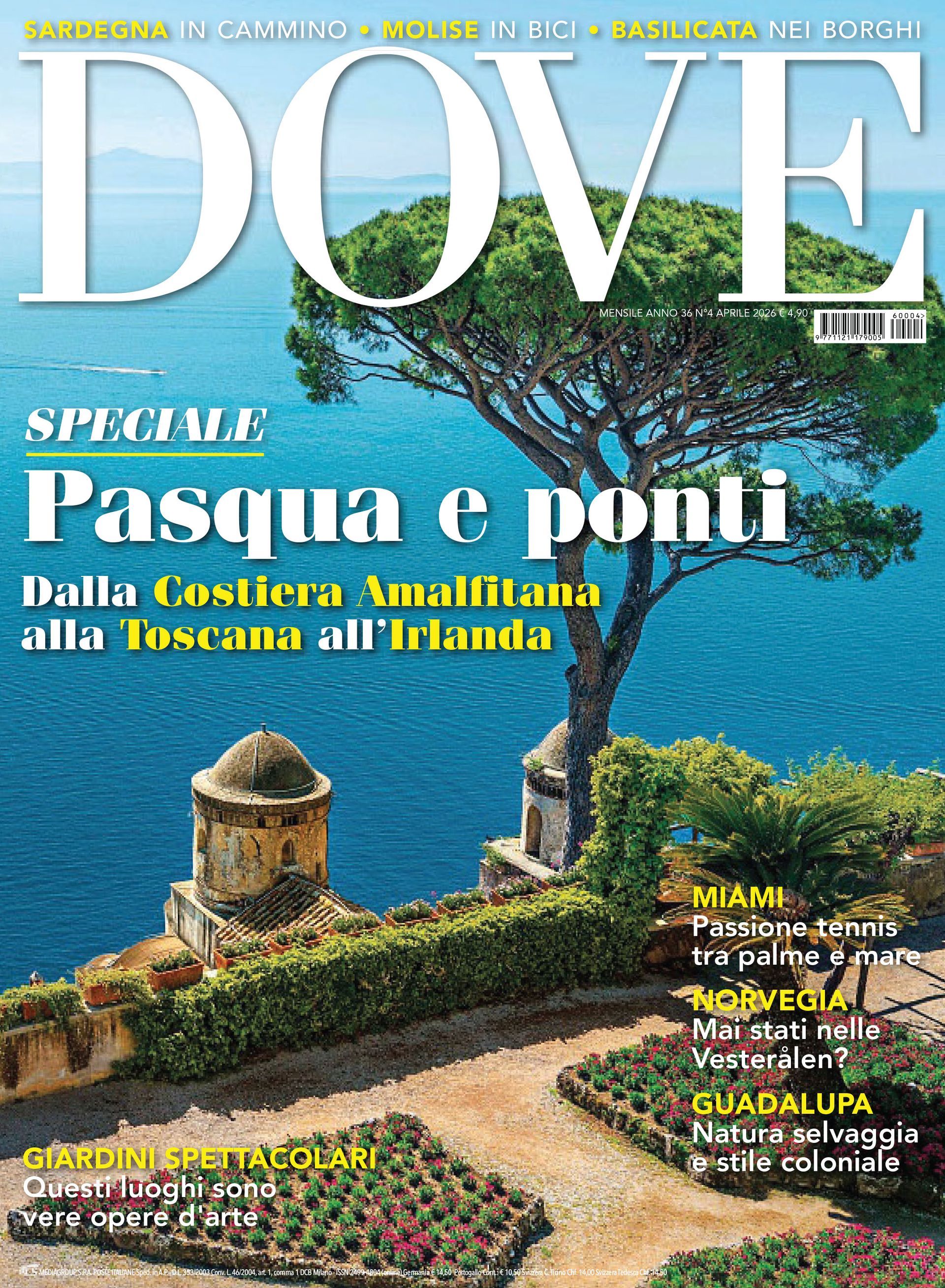 A scenic view of a blue bay along the rocky, green Sorrento Peninsula with a small boat traveling on the water.
