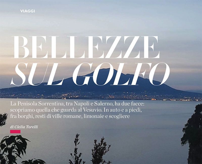 A scenic view of the Gulf of Naples with Mount Vesuvius in the background, overlaid with Italian travel magazine text.