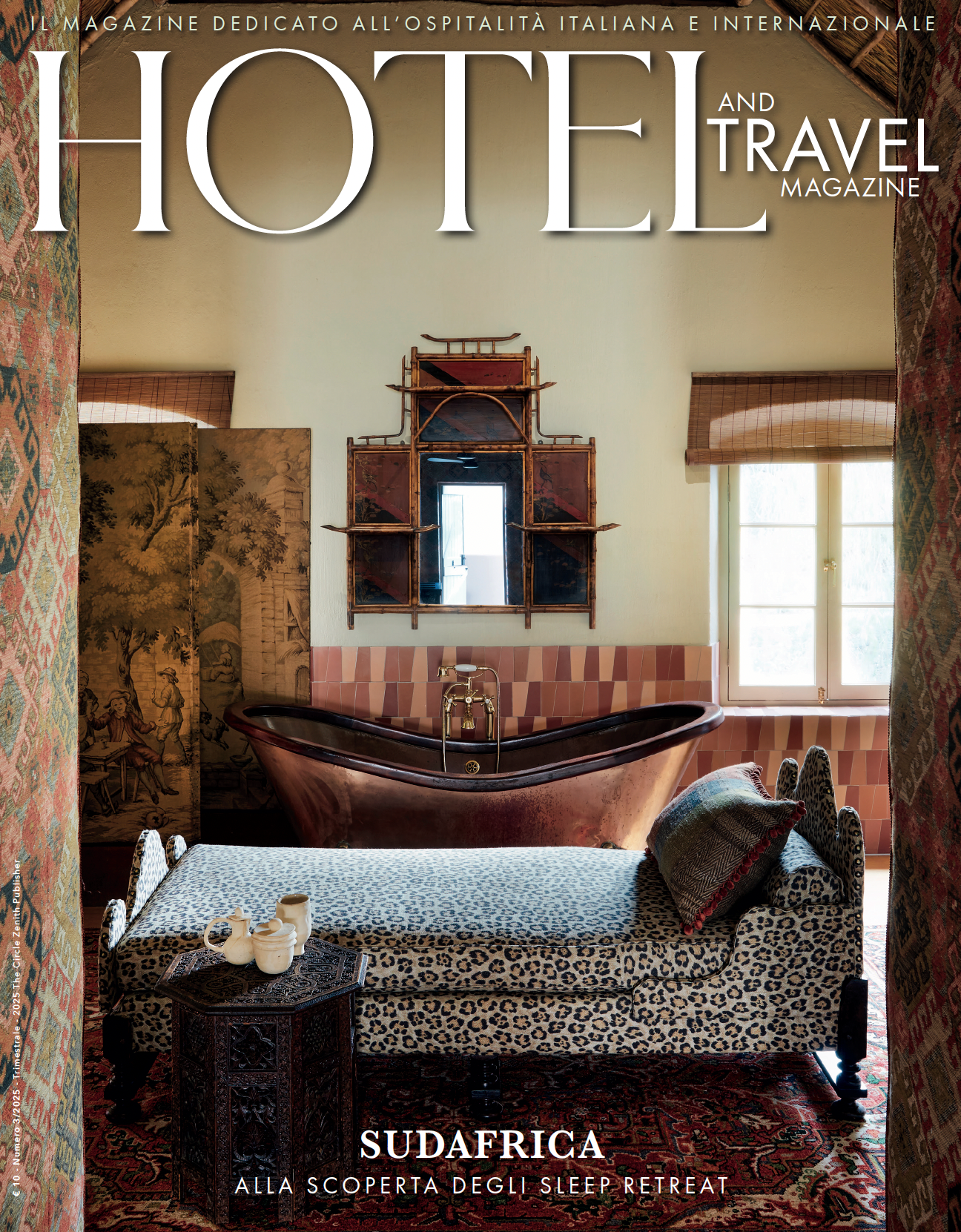 A magazine cover titled Hotel and Travel featuring a bedroom with a copper bathtub, patterned daybed, and decorative mirror.