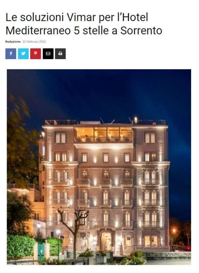 Hotel Mediterraneo, a five-star building in Sorrento, illuminated at night.