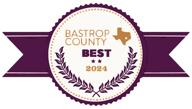 Bastrop County Best 2024 award logo with a gold Texas outline, laurel wreath, and purple ribbon.