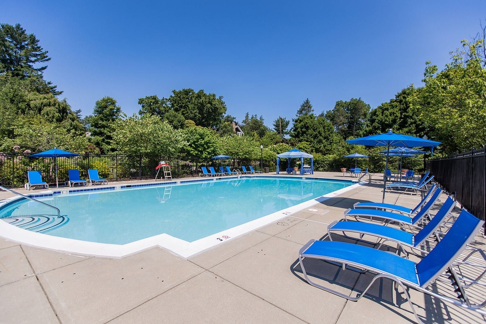Swimming pool and lounge seating at Park Station Apartments.