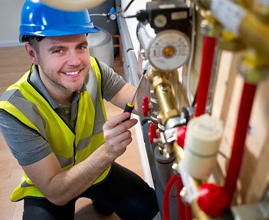 Worker Smiling — North Logan UT — Hytek Water Conditioning Worker Smiling — North Logan UT — Hytek Water Conditioning