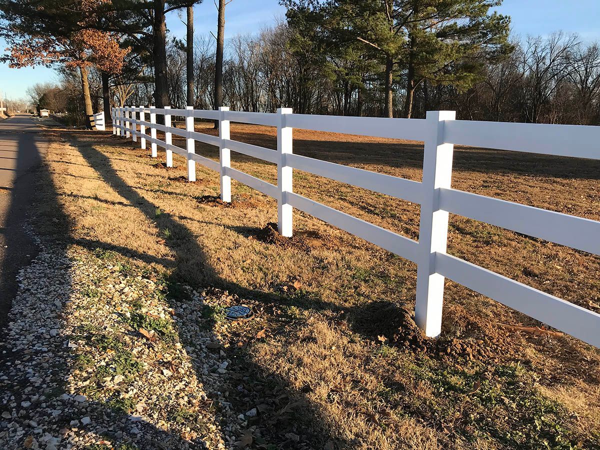 Wooden fence with wire mesh in a corner.