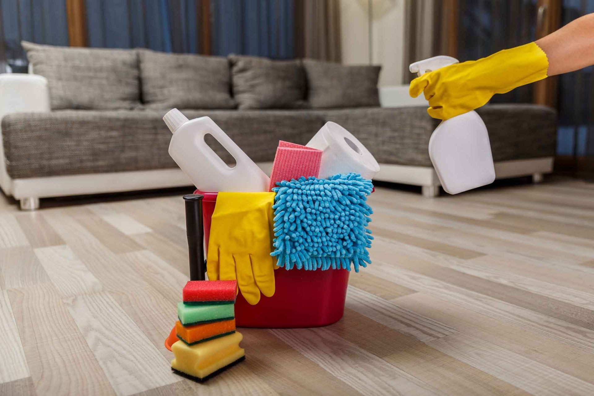A person is cleaning the floor in a living room.