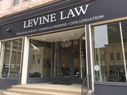 Exterior of Levine Law office with the address 630 visible above the entrance.