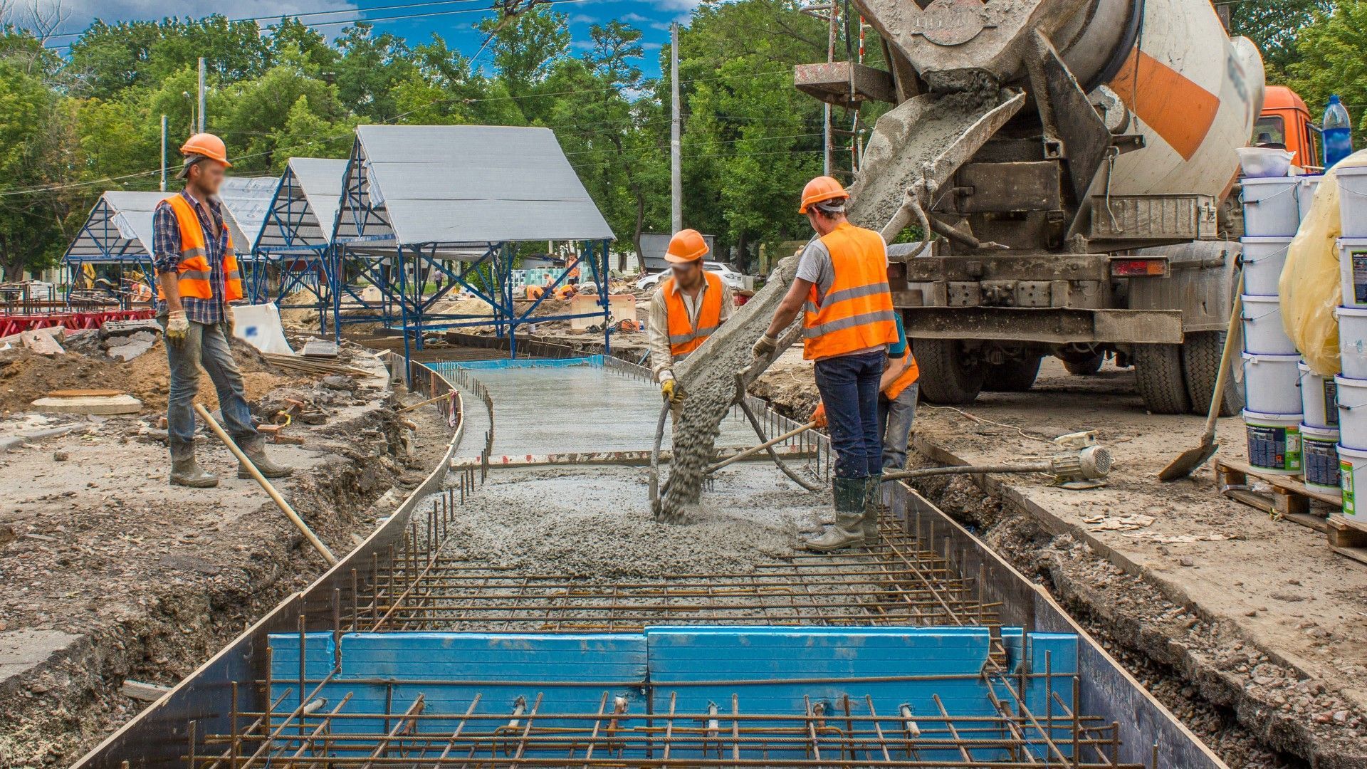 A group of construction workers are working on a construction site.