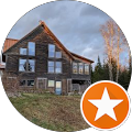 A large house with a star in the middle of a circle.