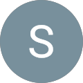 The letter s is in a blue circle on a white background.