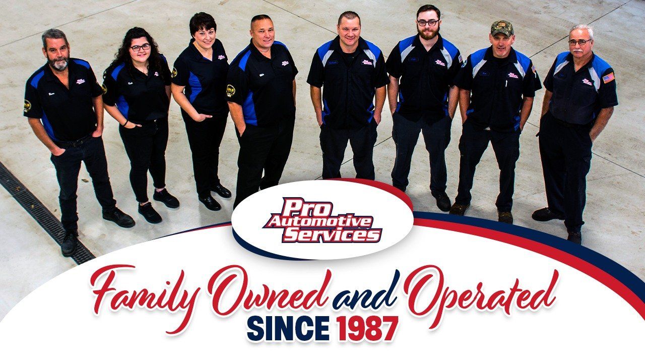 A group of people standing in front of a sign that says family owned and operated since 1987