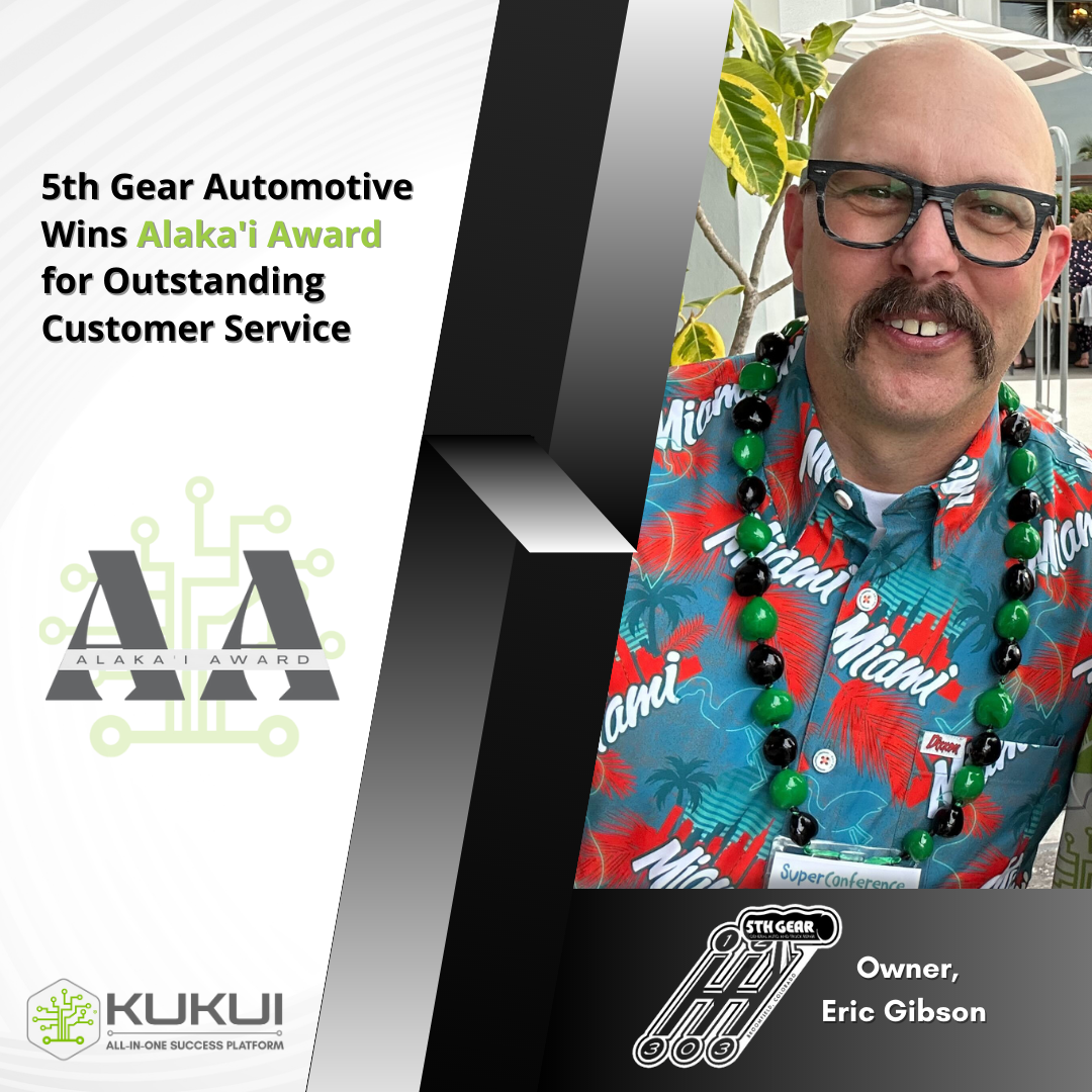 A man with a mustache and glasses is wearing a hawaiian shirt.