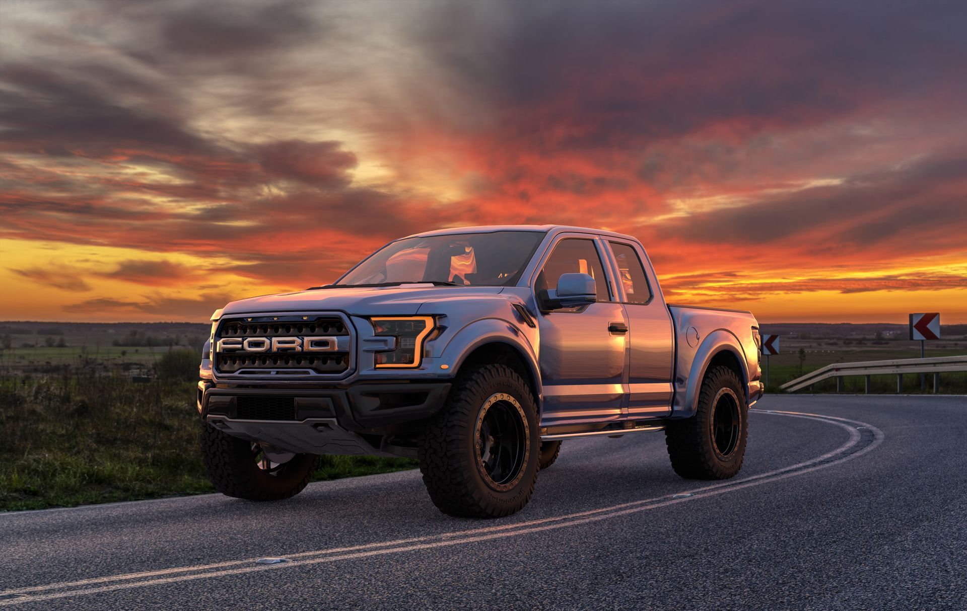 A ford raptor is parked on the side of a road at sunset.