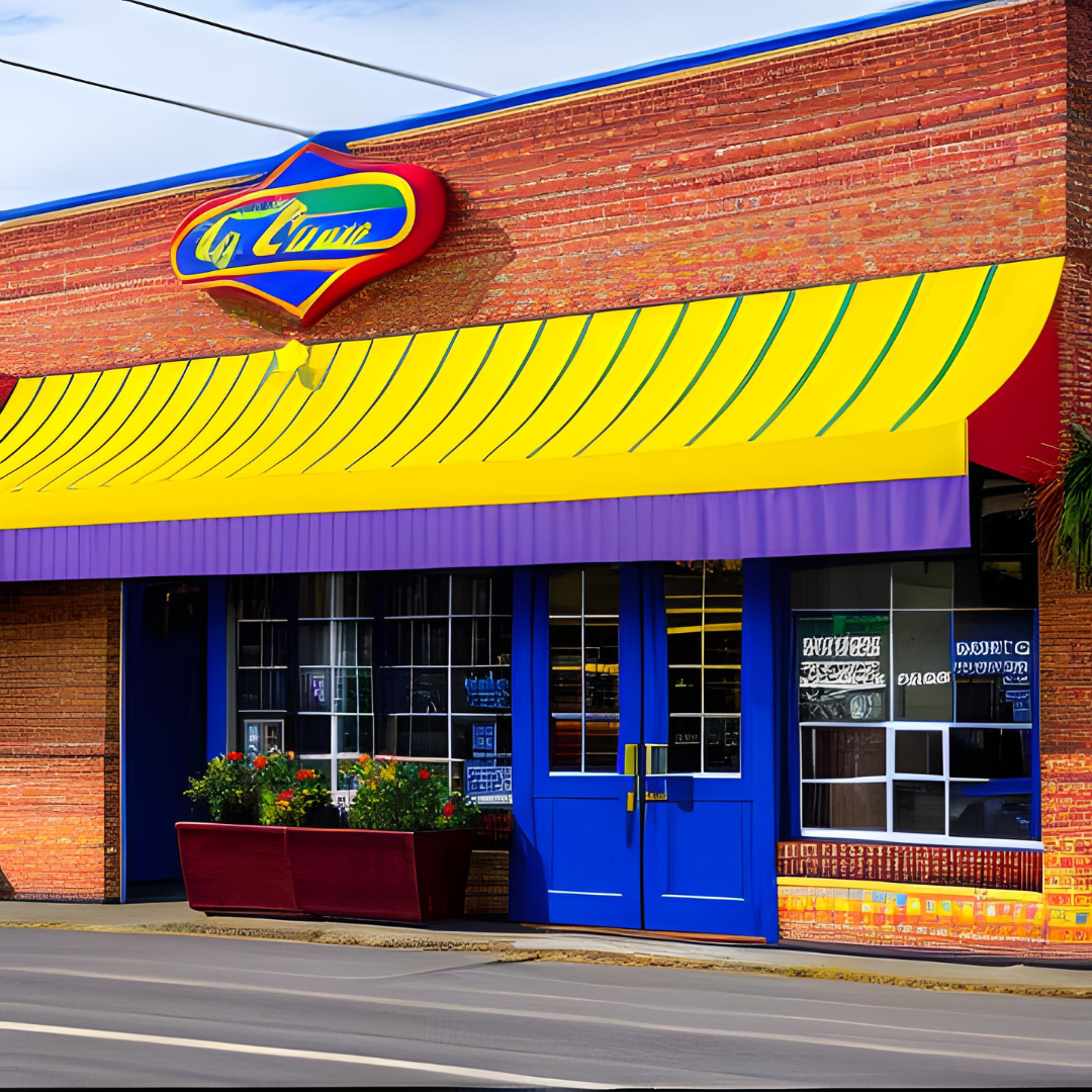 A brick building with a yellow awning that says la cima